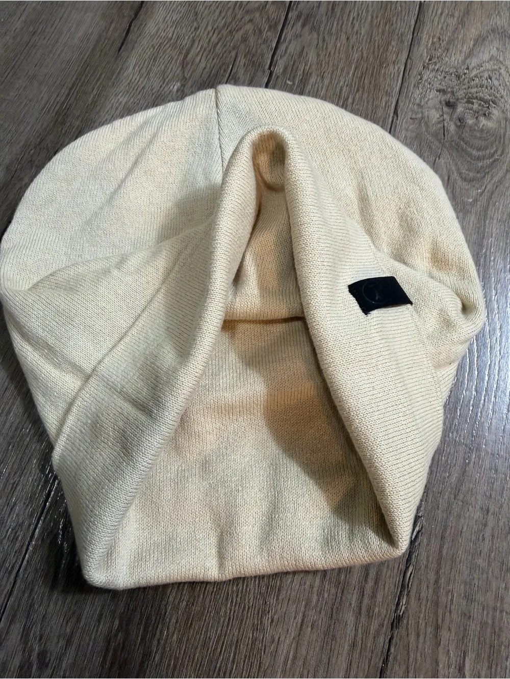 Cream Beanie Hat with Small Black Logo Tab
